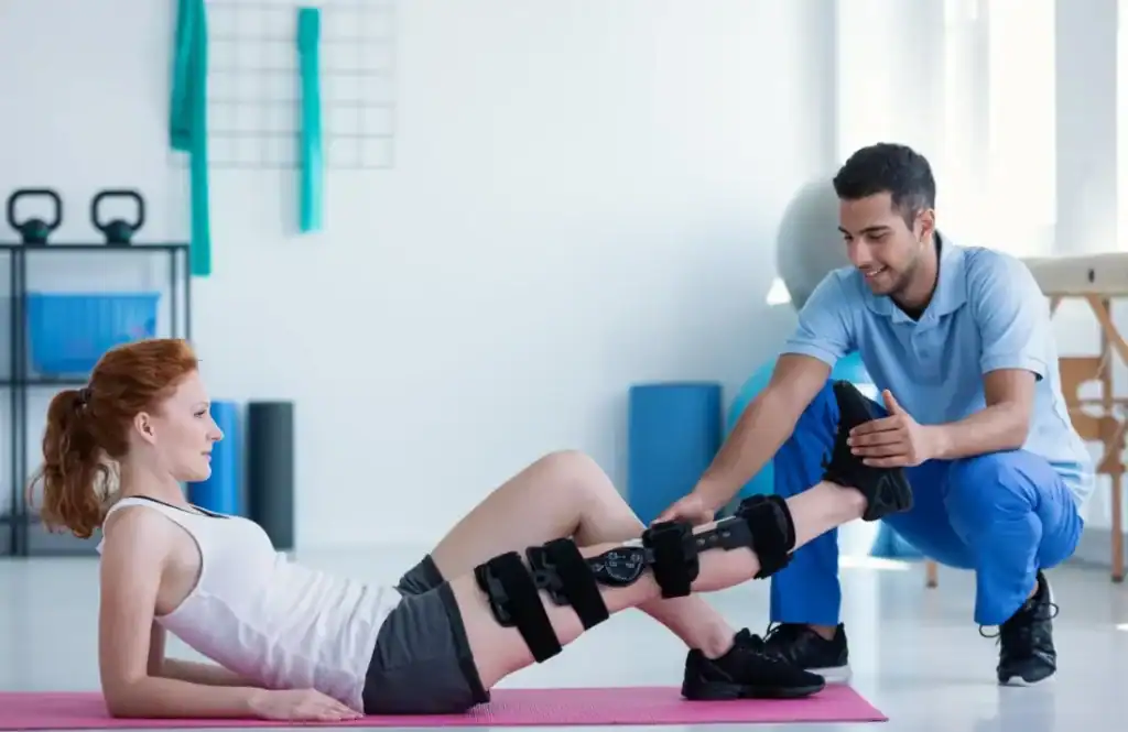 Woman having treatment to help muscle recovery Cheltenham after an injury